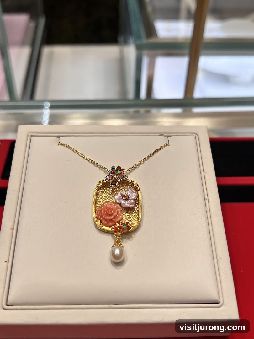 Pendant with floral and butterfly design