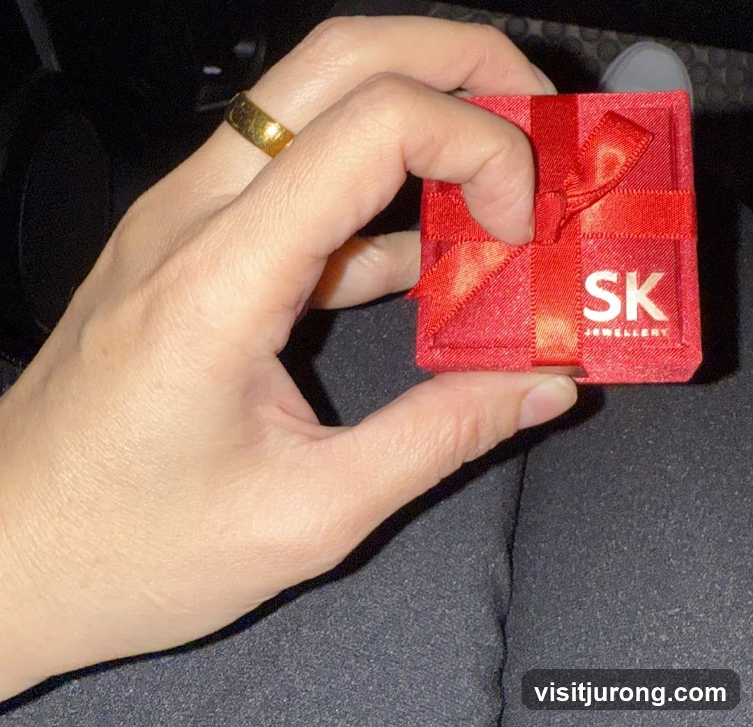 Hand holding a jewelry box