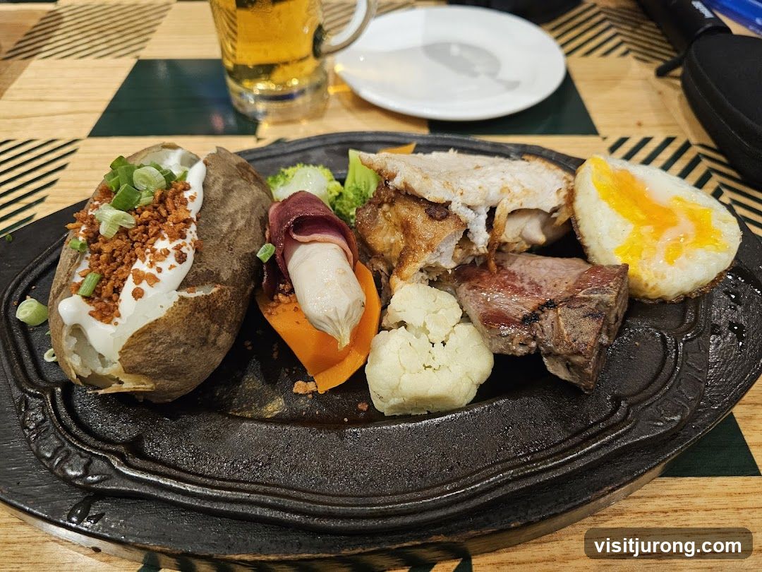 Platter of food with baked potato, meat, and egg