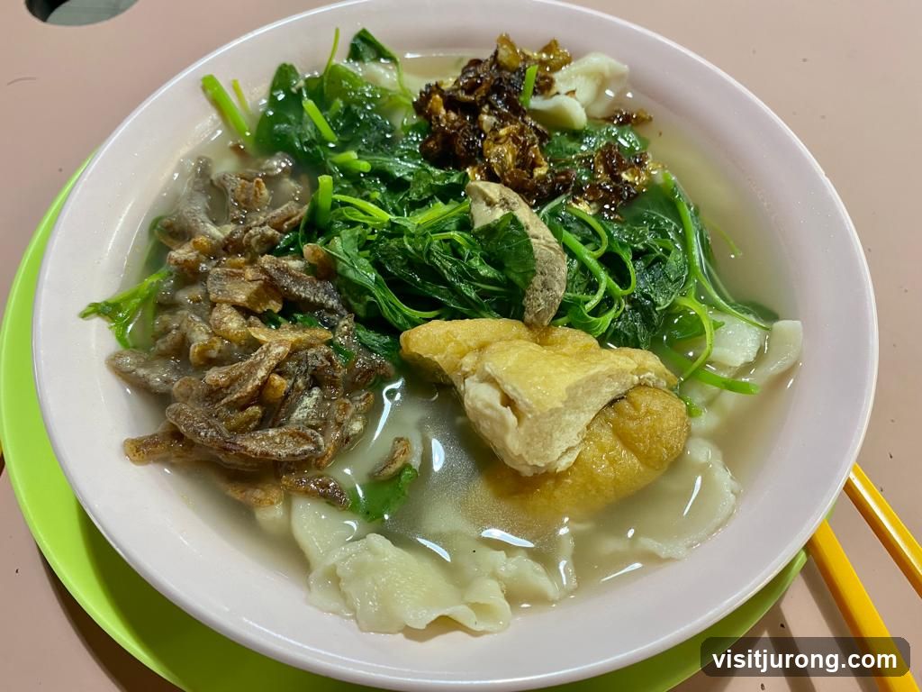 Bowl of Noodles with Vegetables and Fried Anchovies