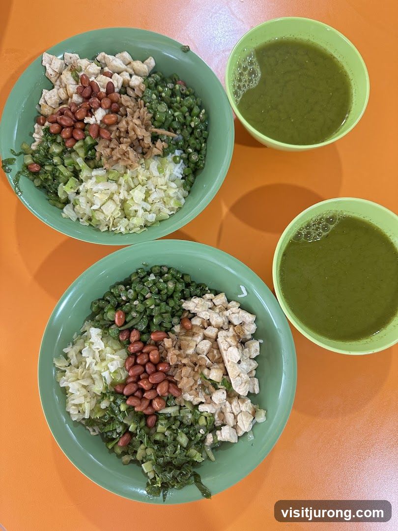 Two bowls of rice with toppings and drinks