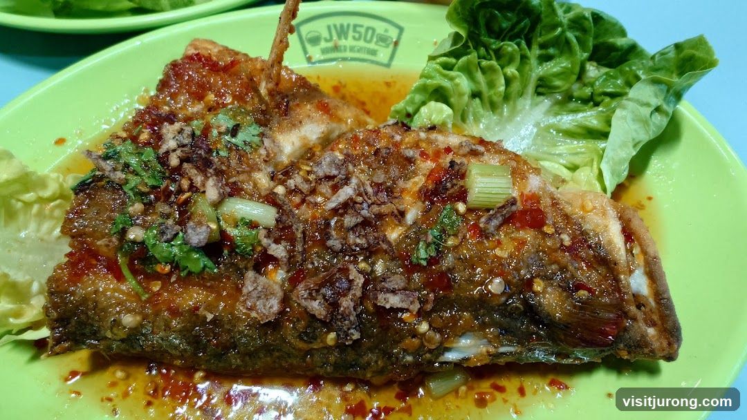 Fish dish with sauce and lettuce