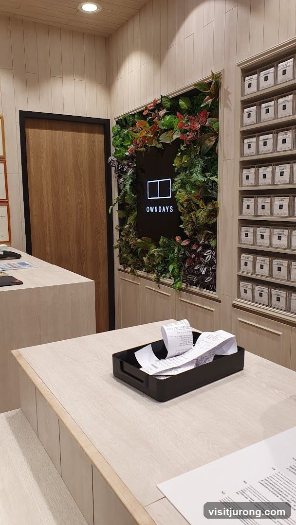 Interior of a store with a living wall and product displays
