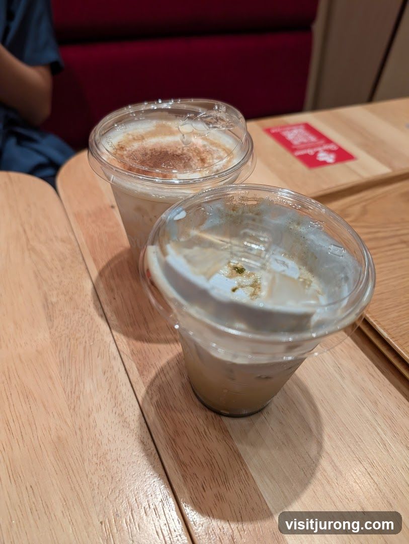 Two Iced Drinks on a Wooden Table