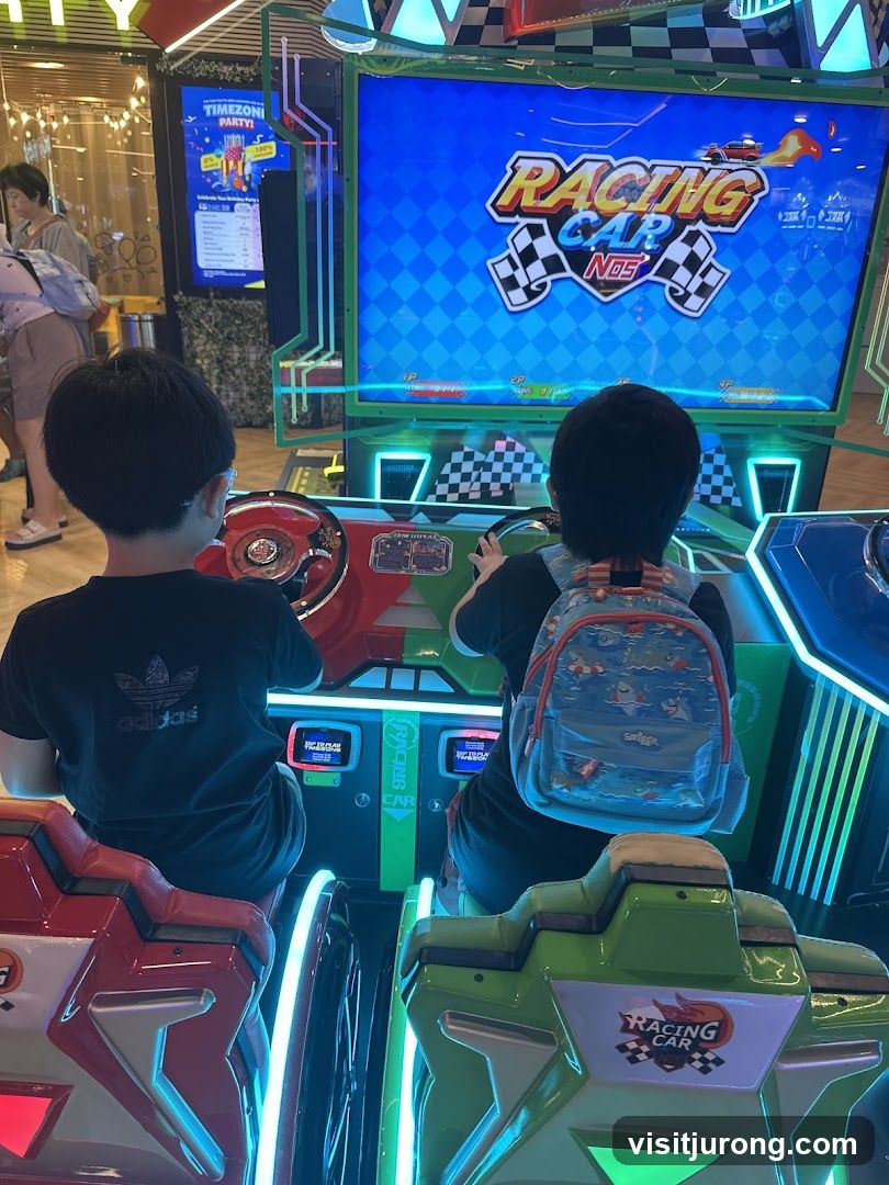 Children playing a racing arcade game