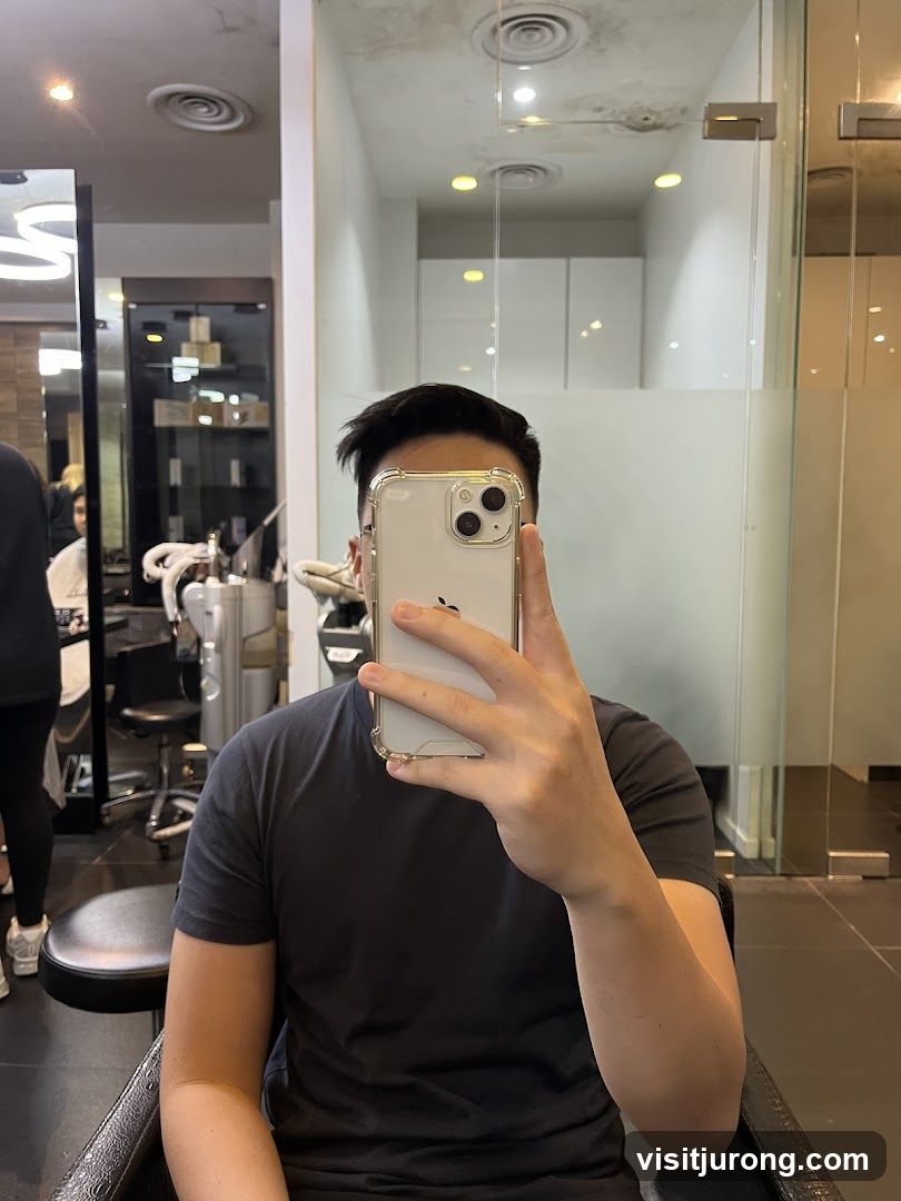 Man taking a selfie in a salon