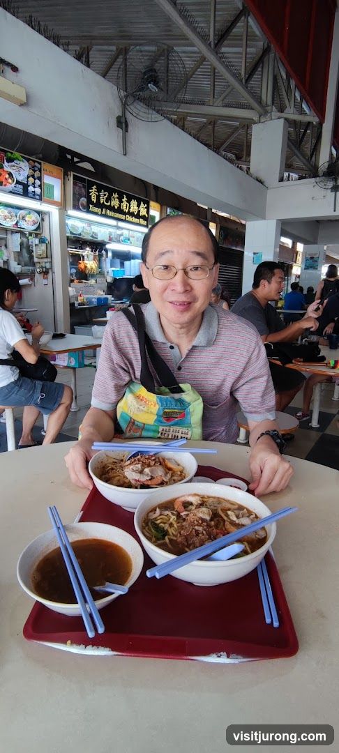 Man with food at a hawker center