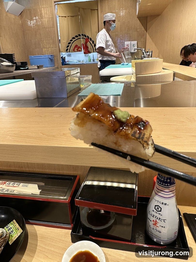 Sushi being held with chopsticks