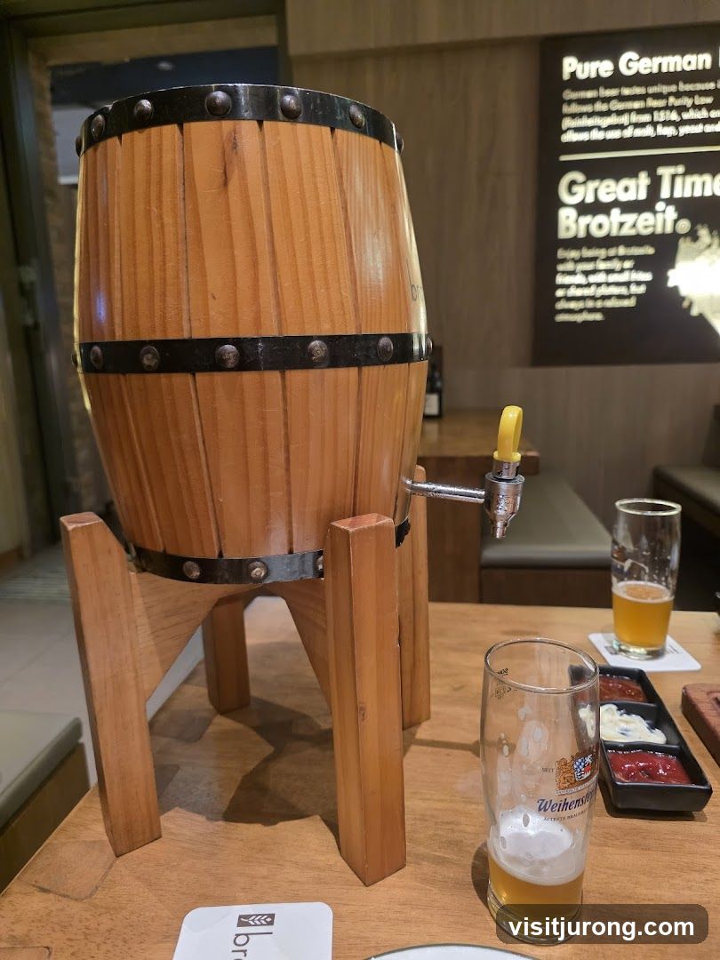 Wooden beer barrel with tap and glasses