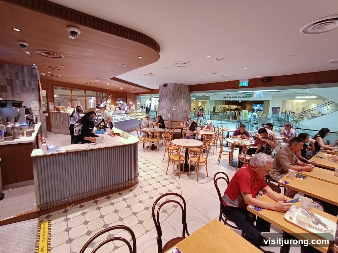 Interior of a busy cafe with customers dining