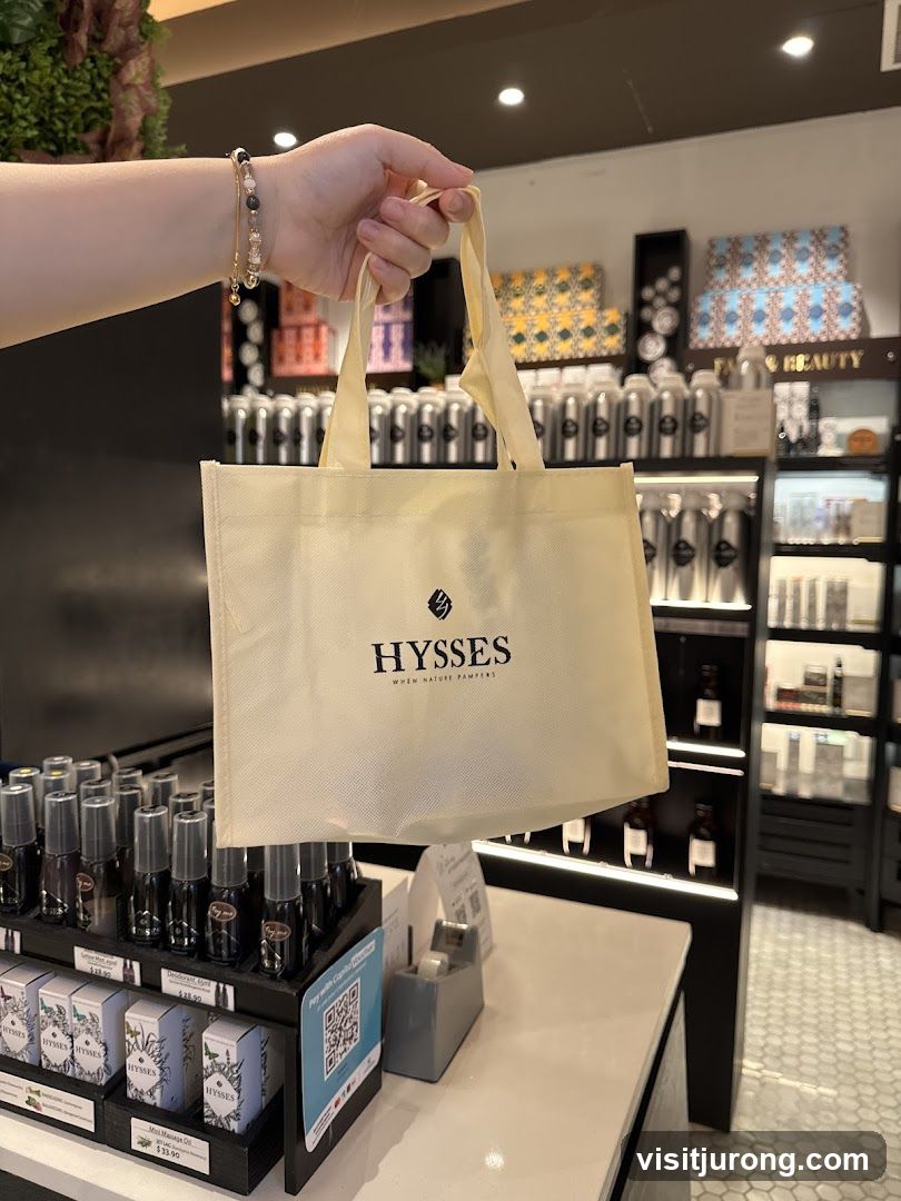 Person holding a branded shopping bag in a store
