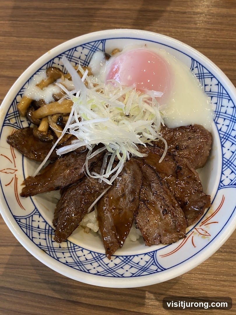 Beef bowl with egg and mushrooms