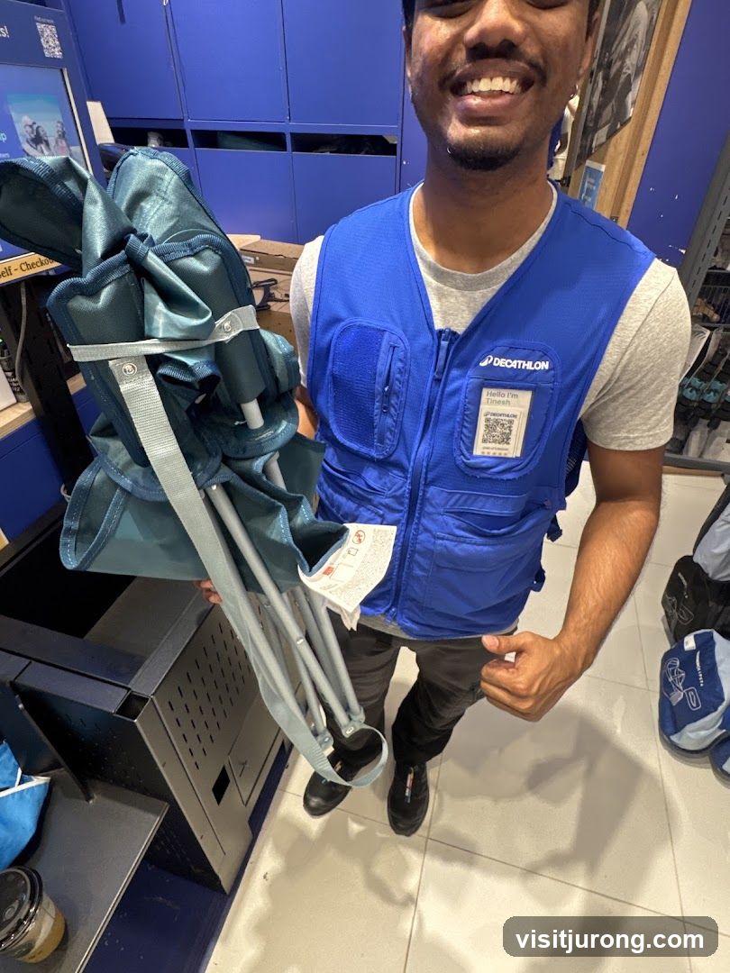 Employee holding camping chair