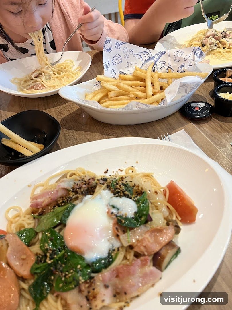 Family enjoying pasta and fries