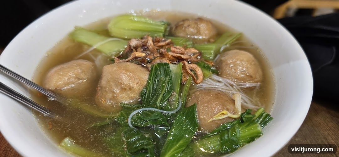 Bowl of Noodle Soup with Meatballs