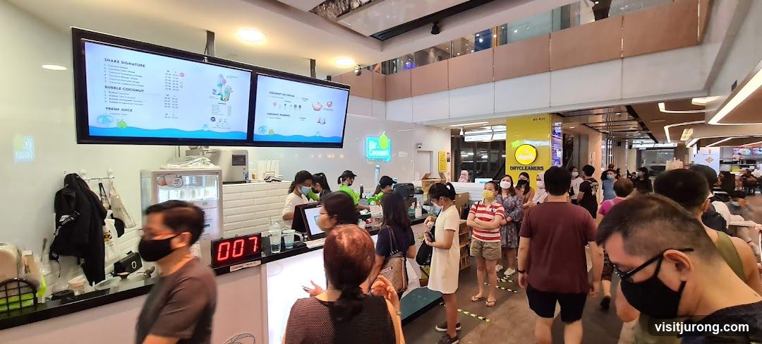 Busy beverage shop with a queue