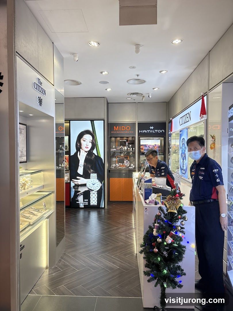 Watch store interior with staff and Christmas decorations