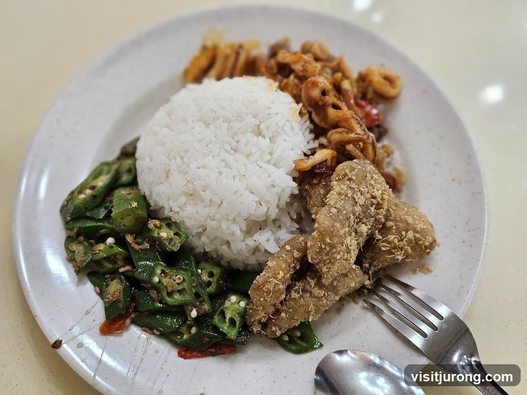 Rice plate with fried chicken, okra, and squid