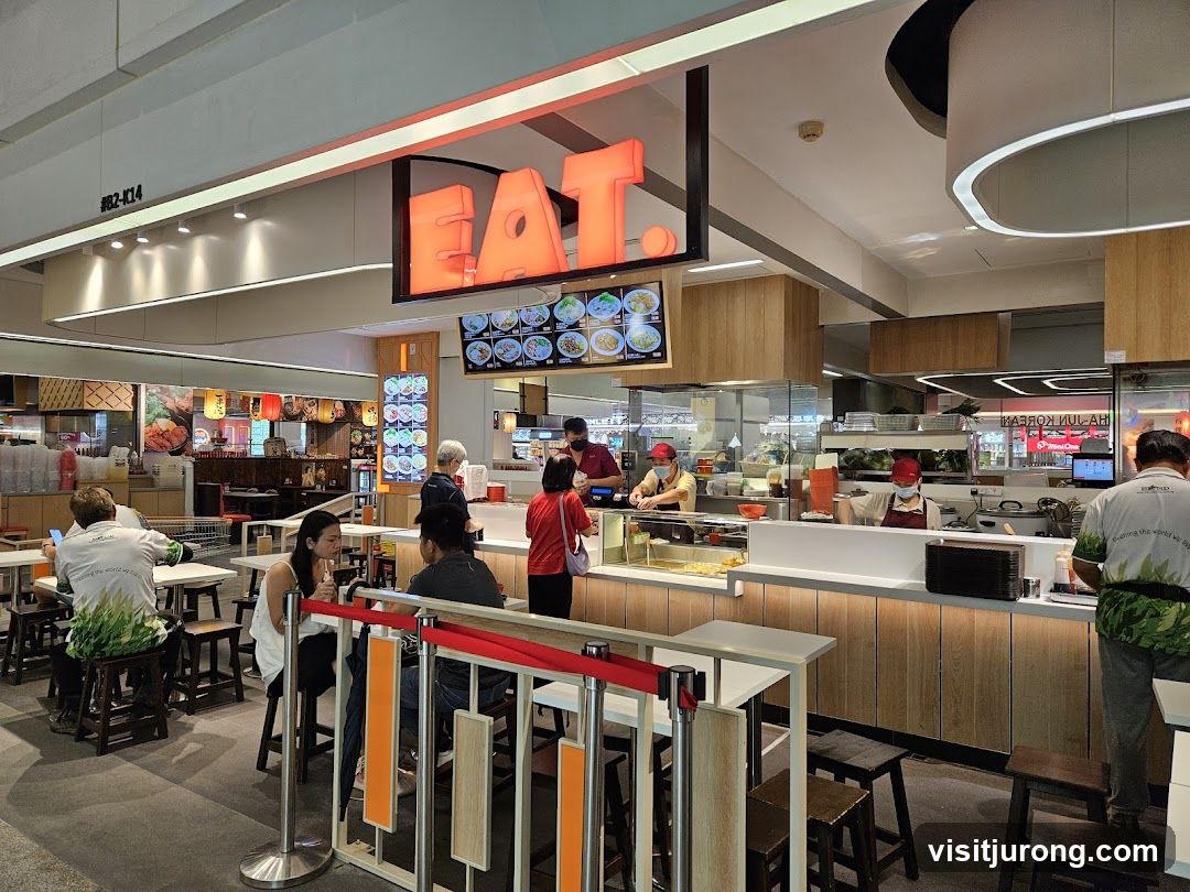 Food court eatery with "EAT" sign