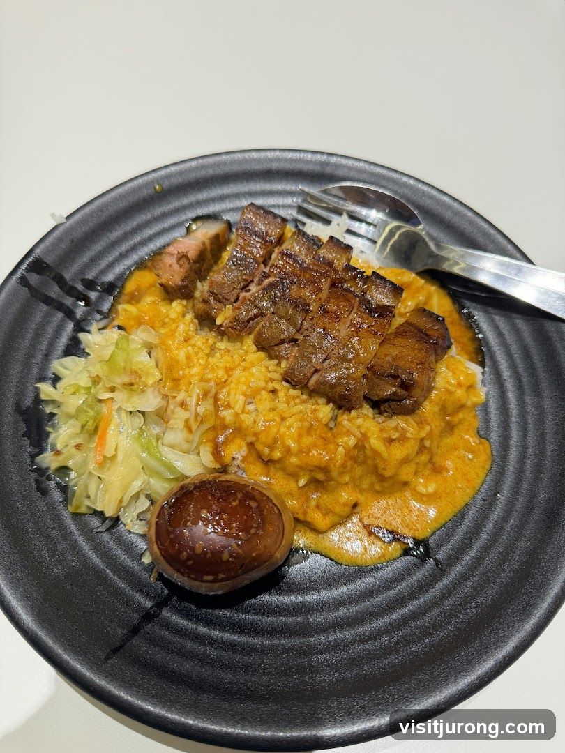 Sliced steak with rice and egg