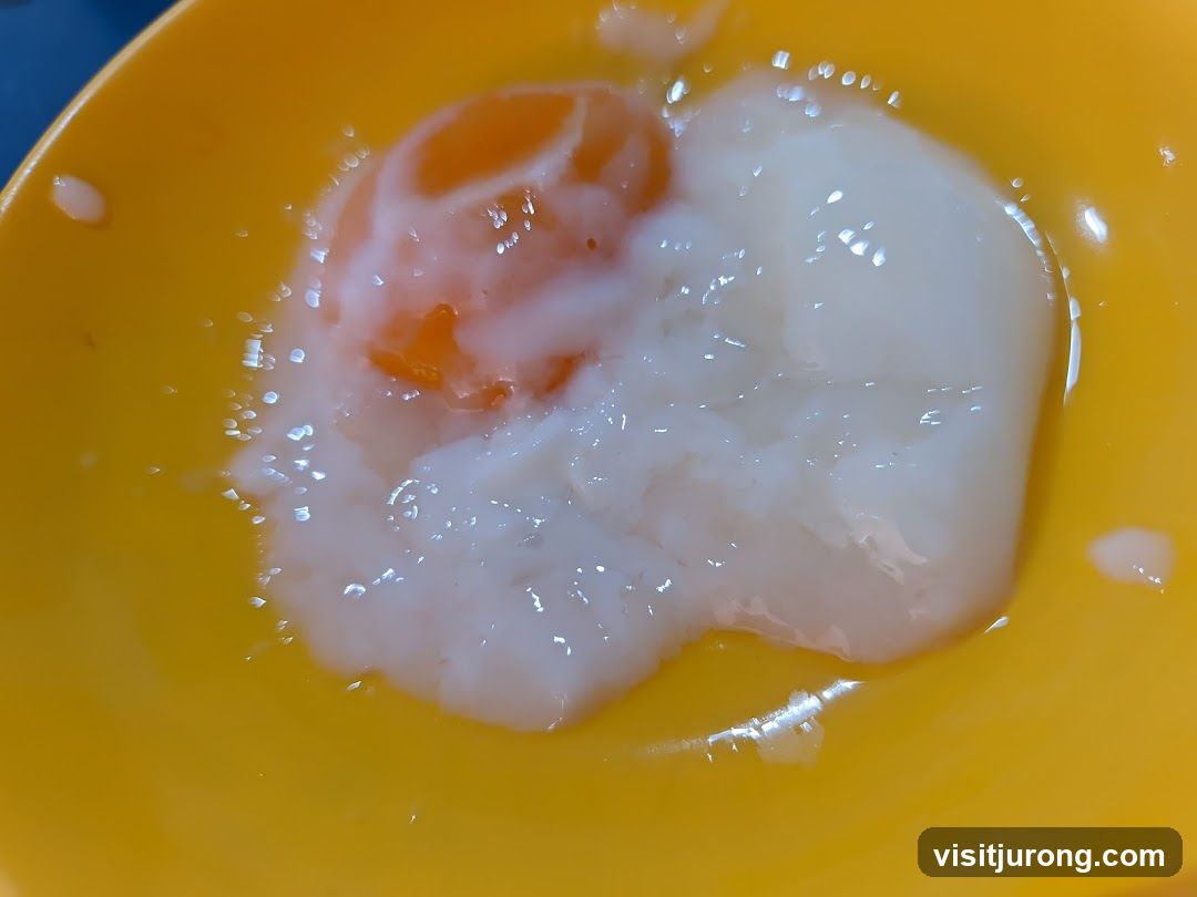 Soft-boiled egg in a yellow bowl