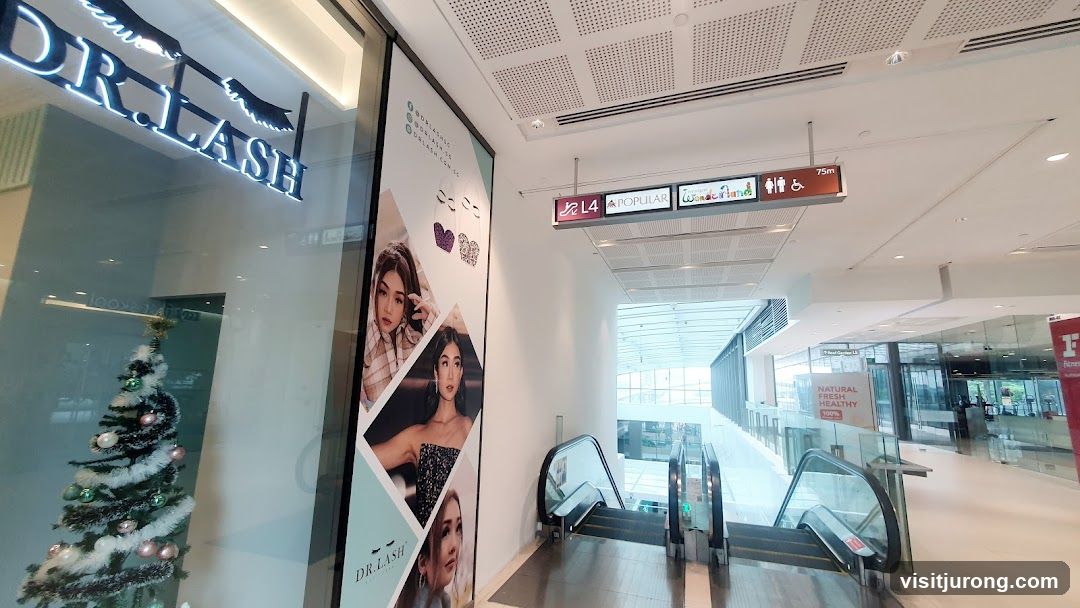 Mall Interior with Escalators and Storefront