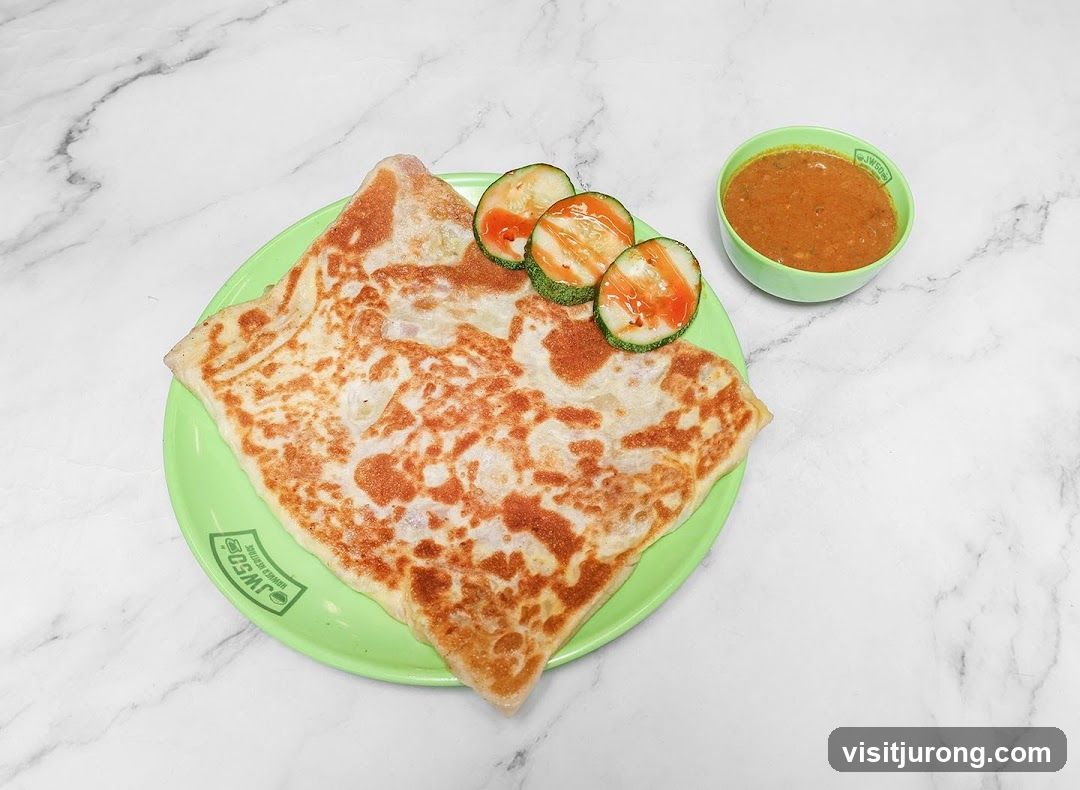 Roti Canai with Curry and Cucumber Slices