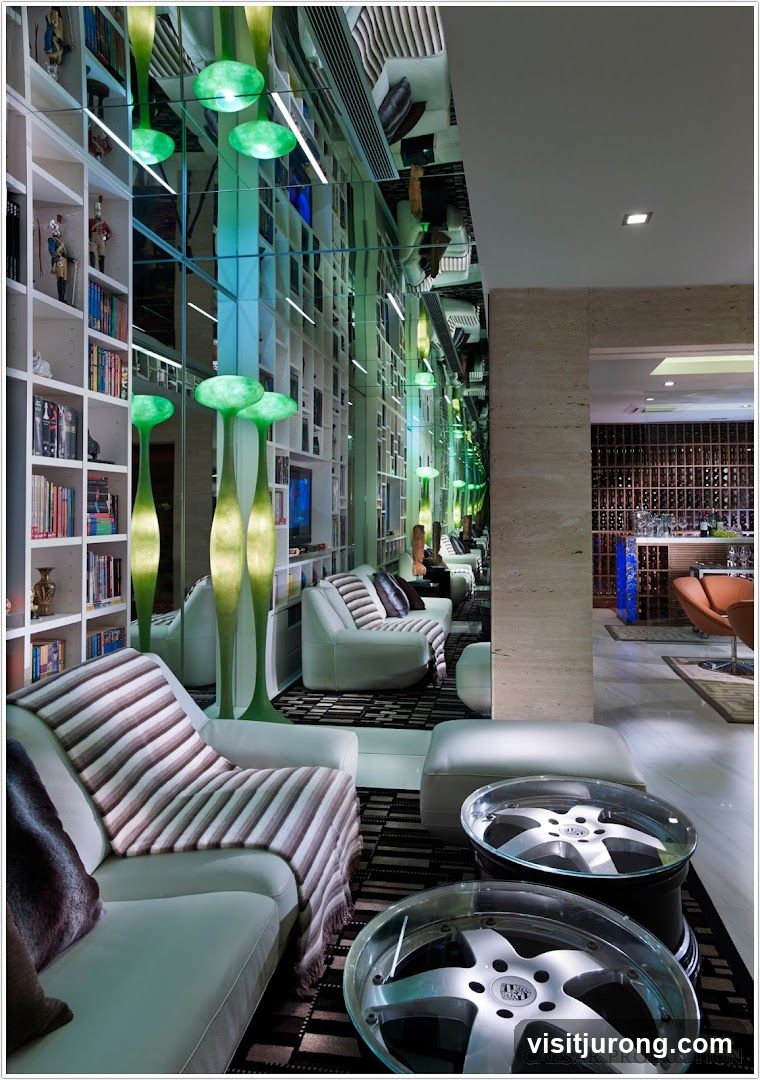 Modern Lounge with Bookshelves and Car Wheel Tables