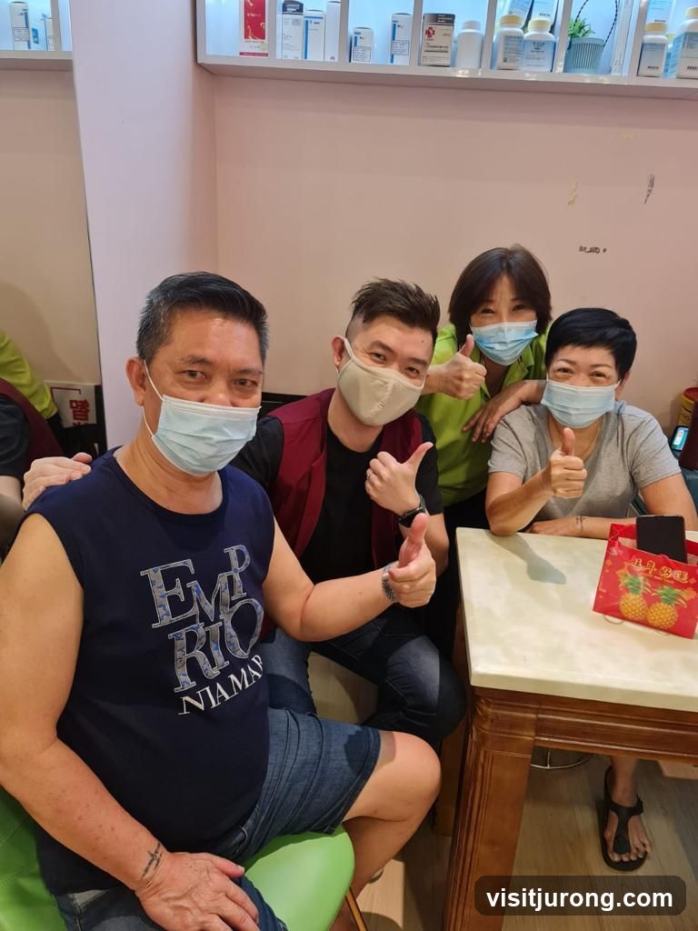 Four people giving thumbs up