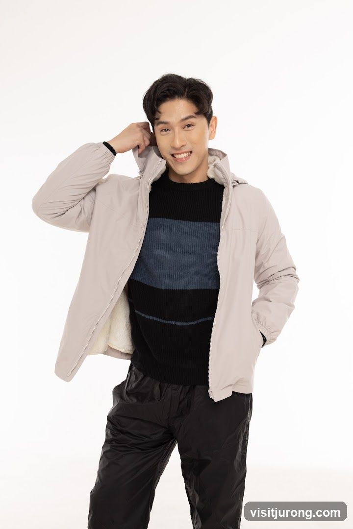 Man in a light-colored jacket and black pants
