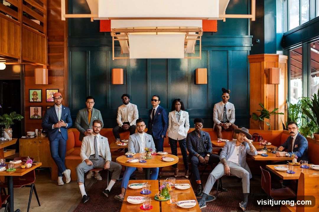 Group of people in suits posing in a restaurant
